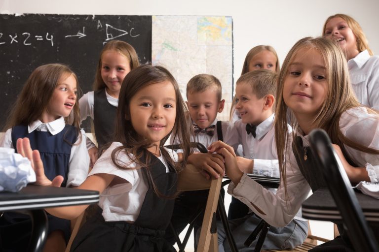 School children in classroom at lesson